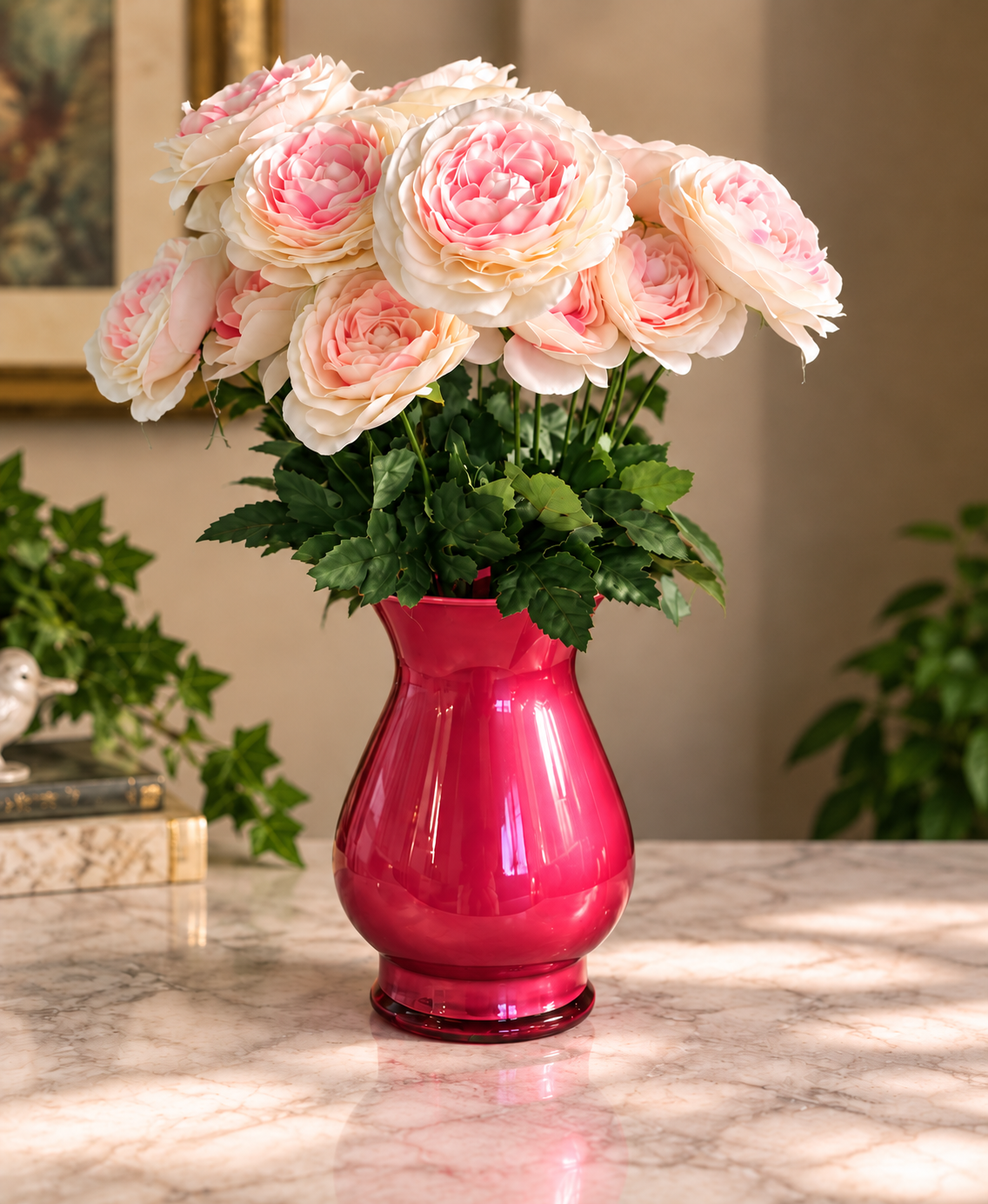 Cream and pink roses in a glossy red vase